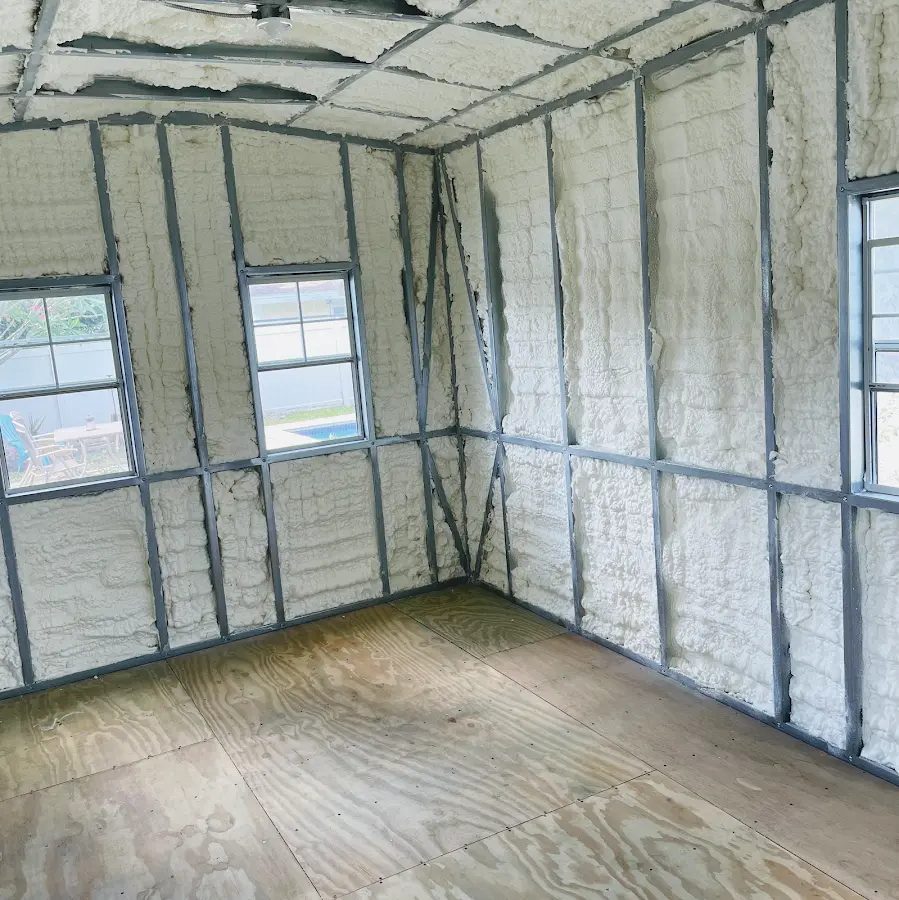 Closed-cell spray foam insulation applied to wall cavities in a residential project in Sidney